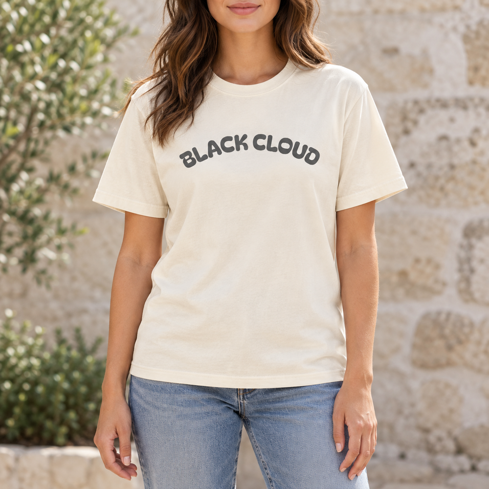 Woman wearing the Ivory Black Cloud graphic T-shirt outdoors