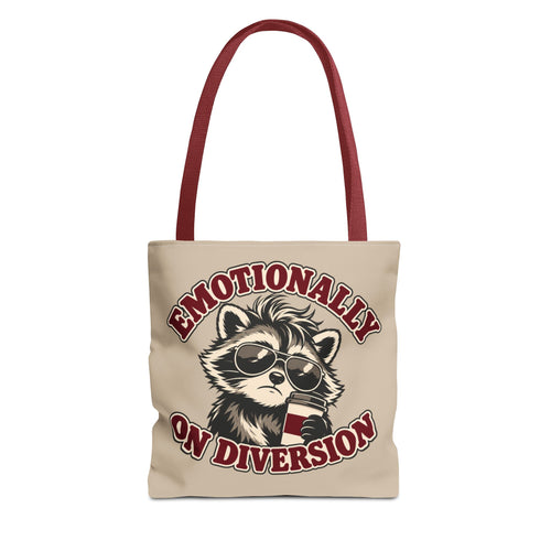 Emotionally on Diversion raccoon tote with Red handles, front view
