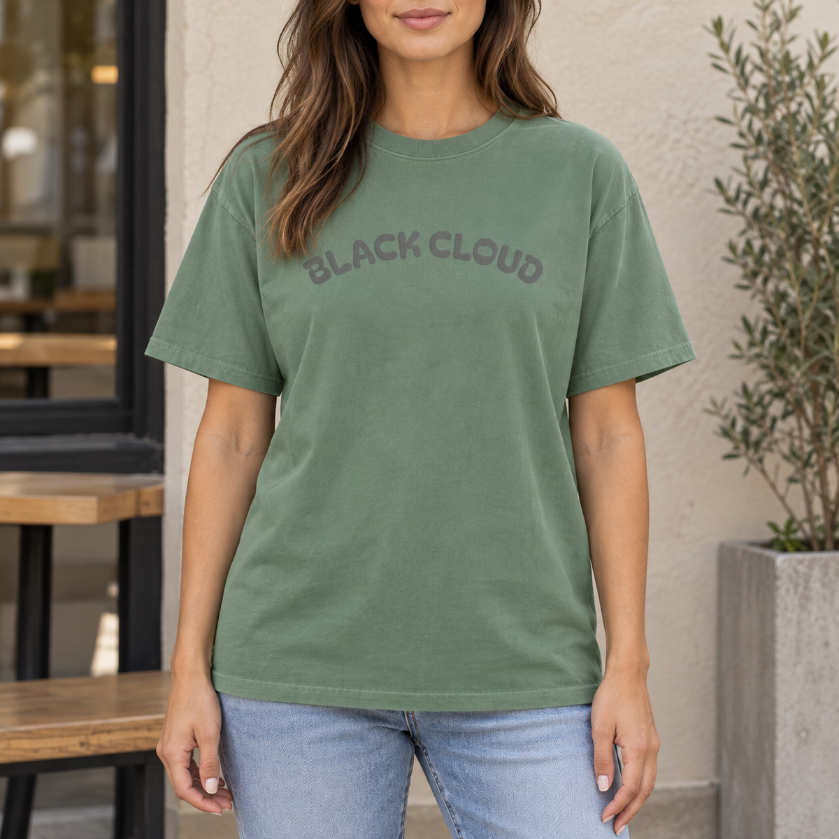 Light Green Black Cloud nurse humor T-shirt worn outdoors in a lifestyle mockup