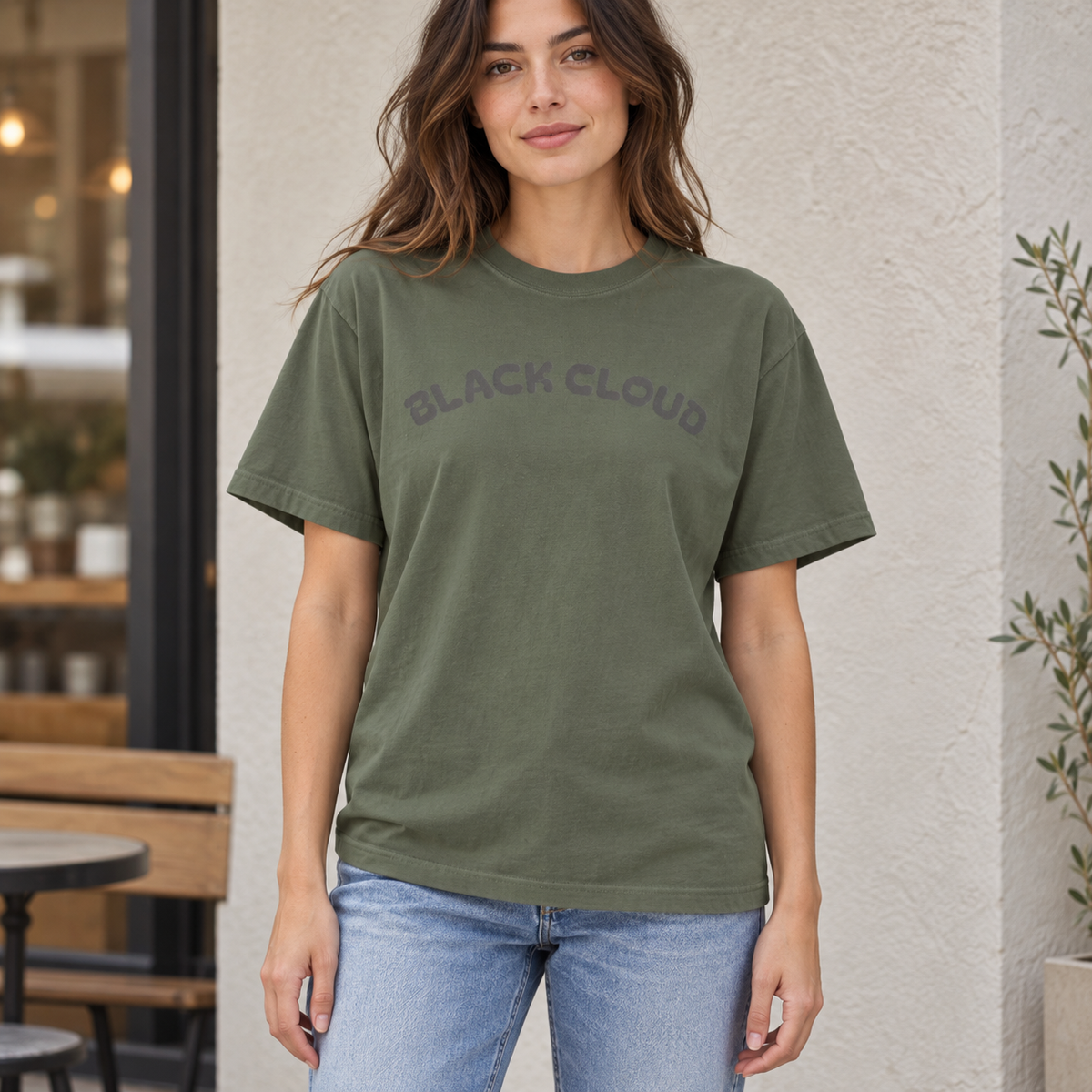 Moss Black Cloud nurse humor T-shirt worn outdoors in a lifestyle mockup