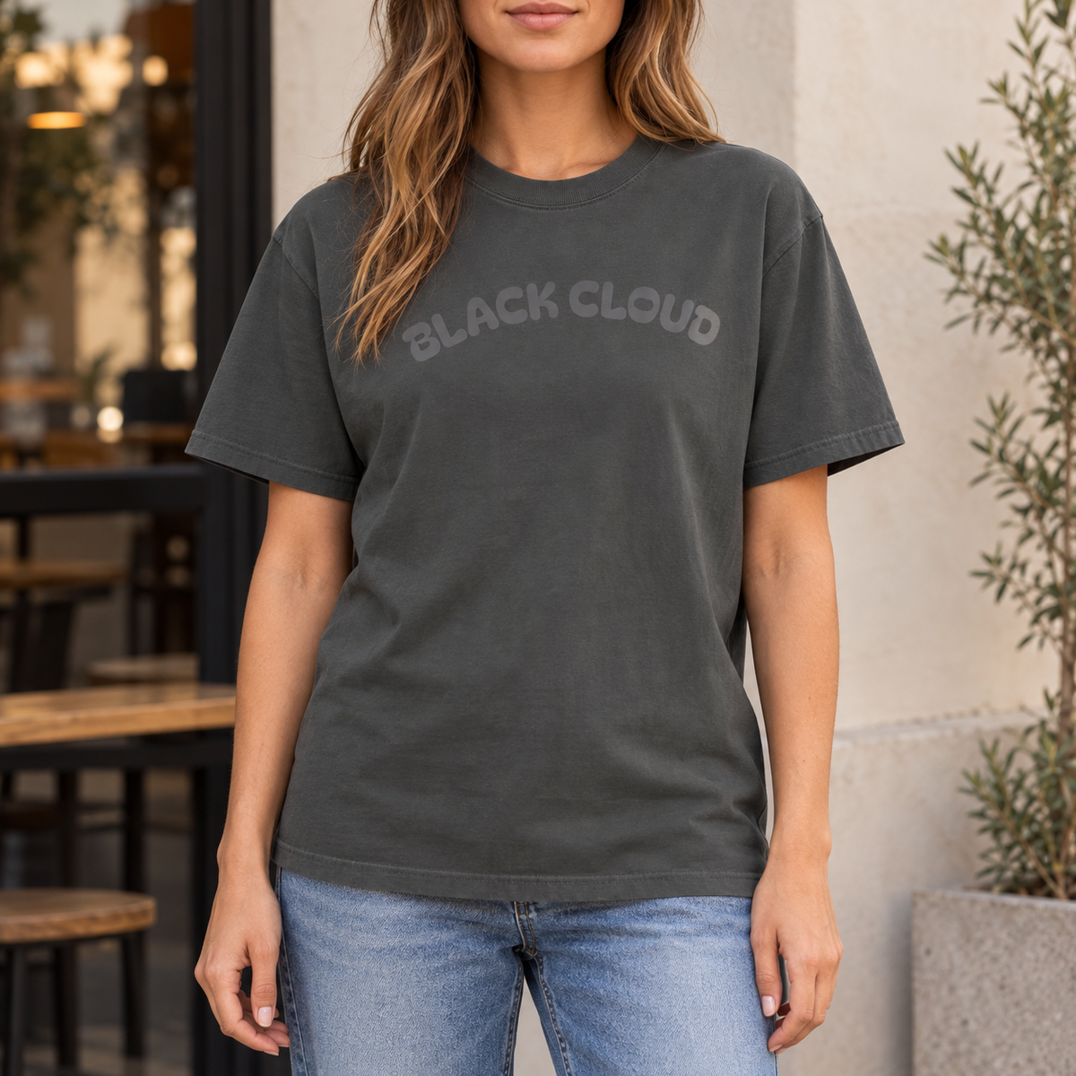 Pepper Black Cloud nurse humor T-shirt worn outdoors in a lifestyle mockup
