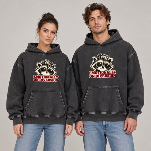 Man and woman wearing the Black Emotionally on Diversion oversized raccoon hoodie