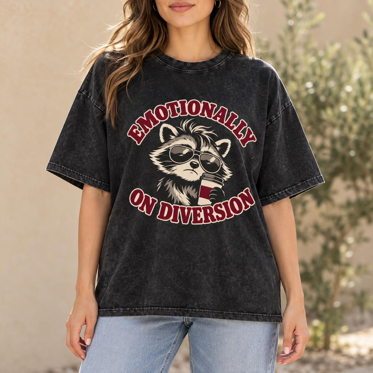 Woman wearing Black Emotionally on Diversion coffee raccoon oversized cotton T-shirt outdoors