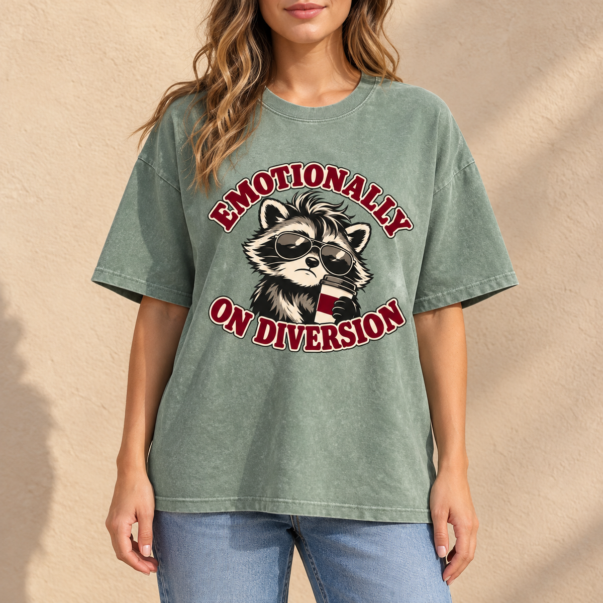 Bean Green Emotionally on Diversion oversized raccoon T-shirt worn outdoors in a lifestyle mockup
