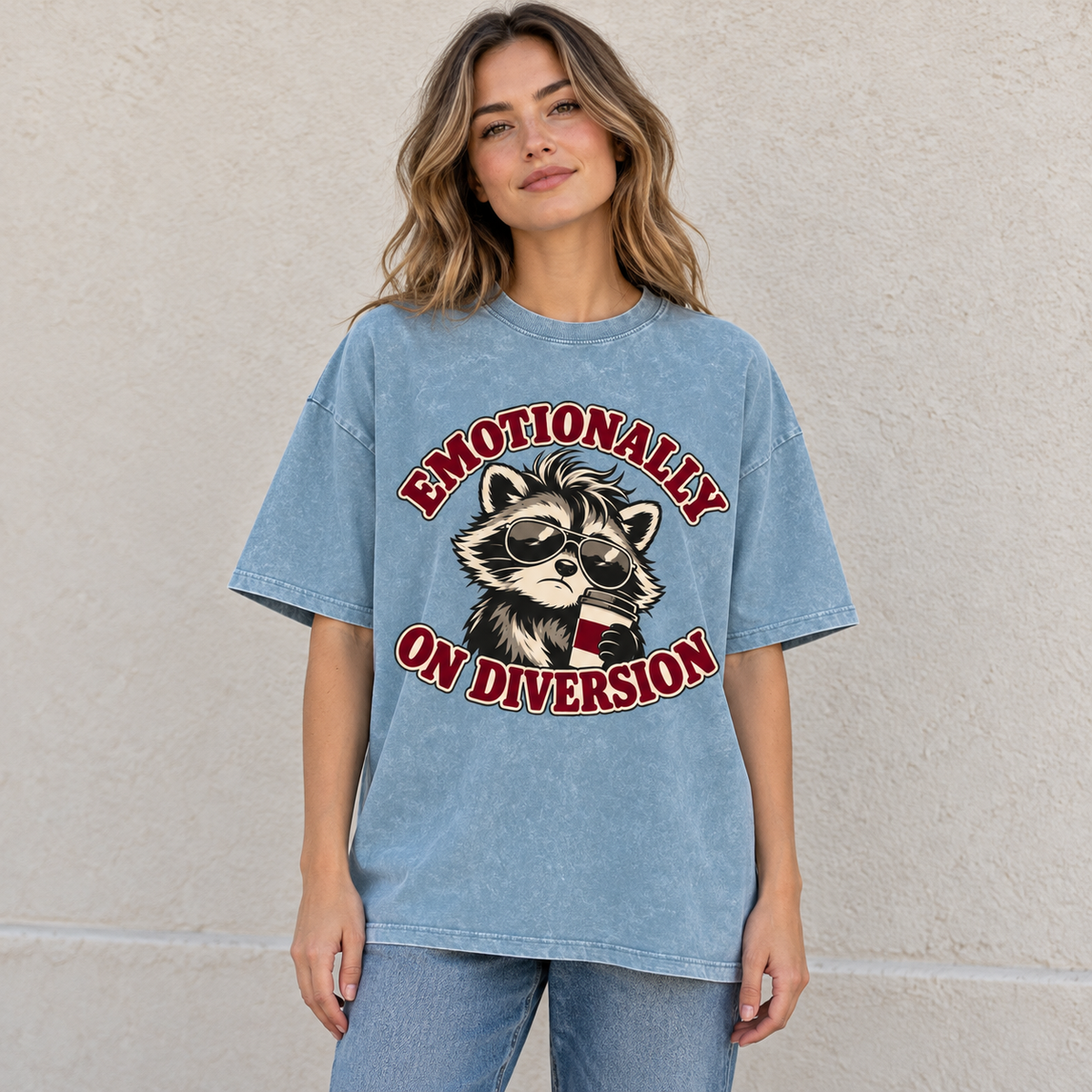 Blue Jeans Emotionally on Diversion oversized raccoon T-shirt worn outdoors in a lifestyle mockup