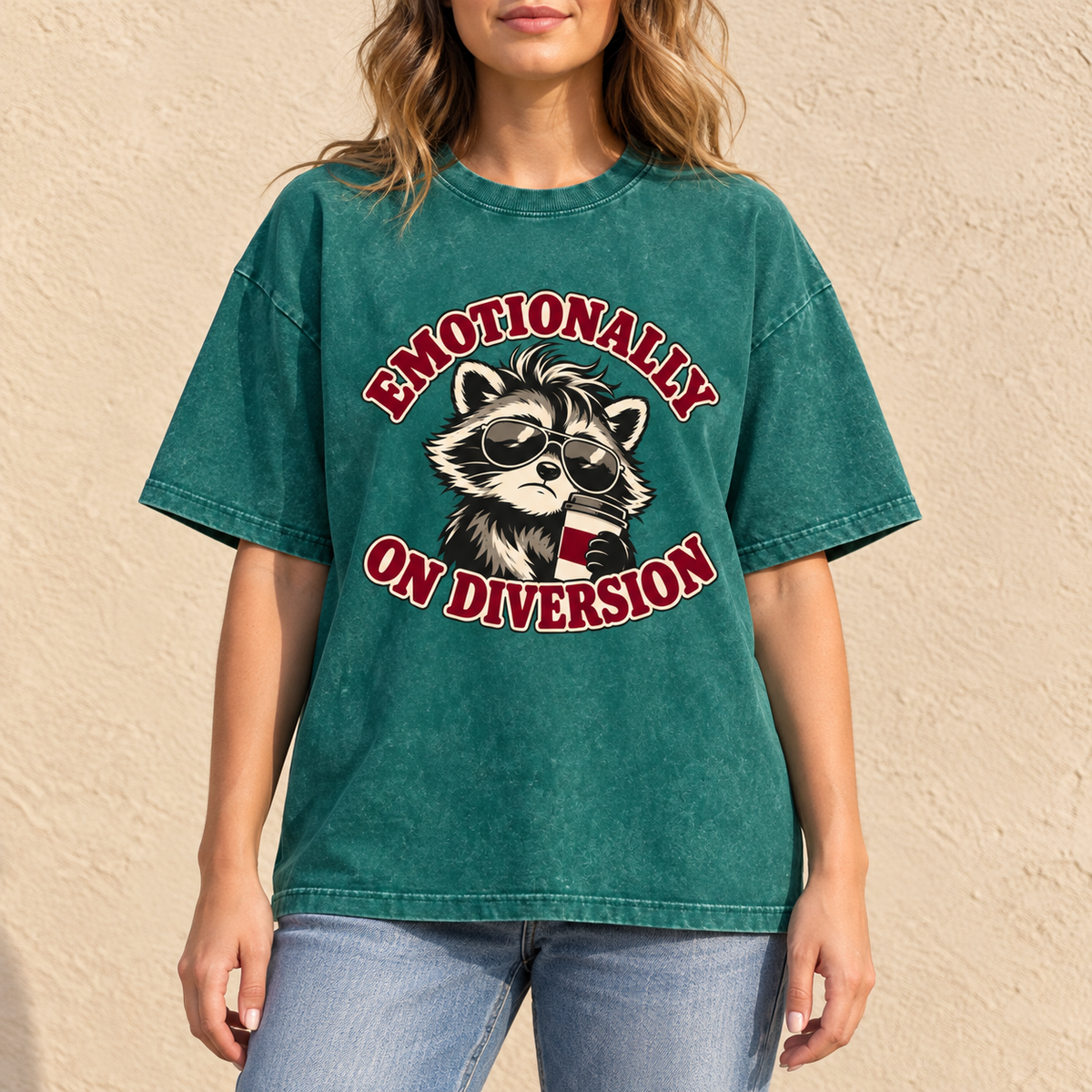 Dark Green Emotionally on Diversion oversized raccoon T-shirt worn outdoors in a lifestyle mockup