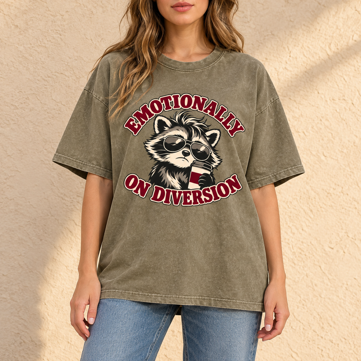 Gray Green Emotionally on Diversion oversized raccoon T-shirt worn outdoors in a lifestyle mockup