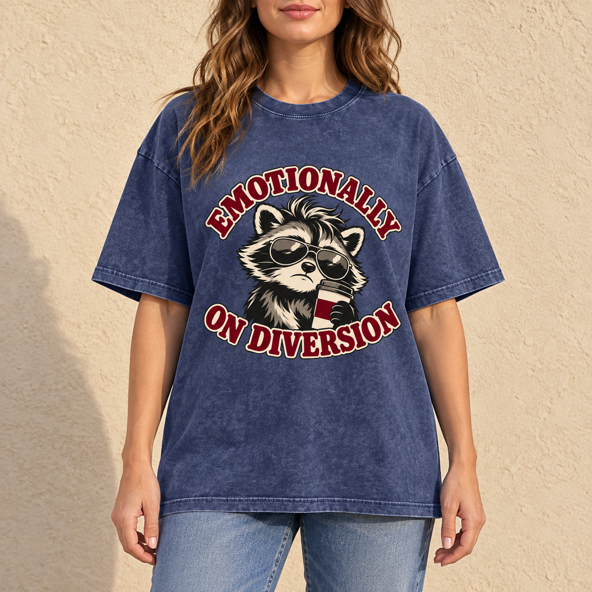 Royal Blue Emotionally on Diversion oversized raccoon T-shirt worn outdoors in a lifestyle mockup